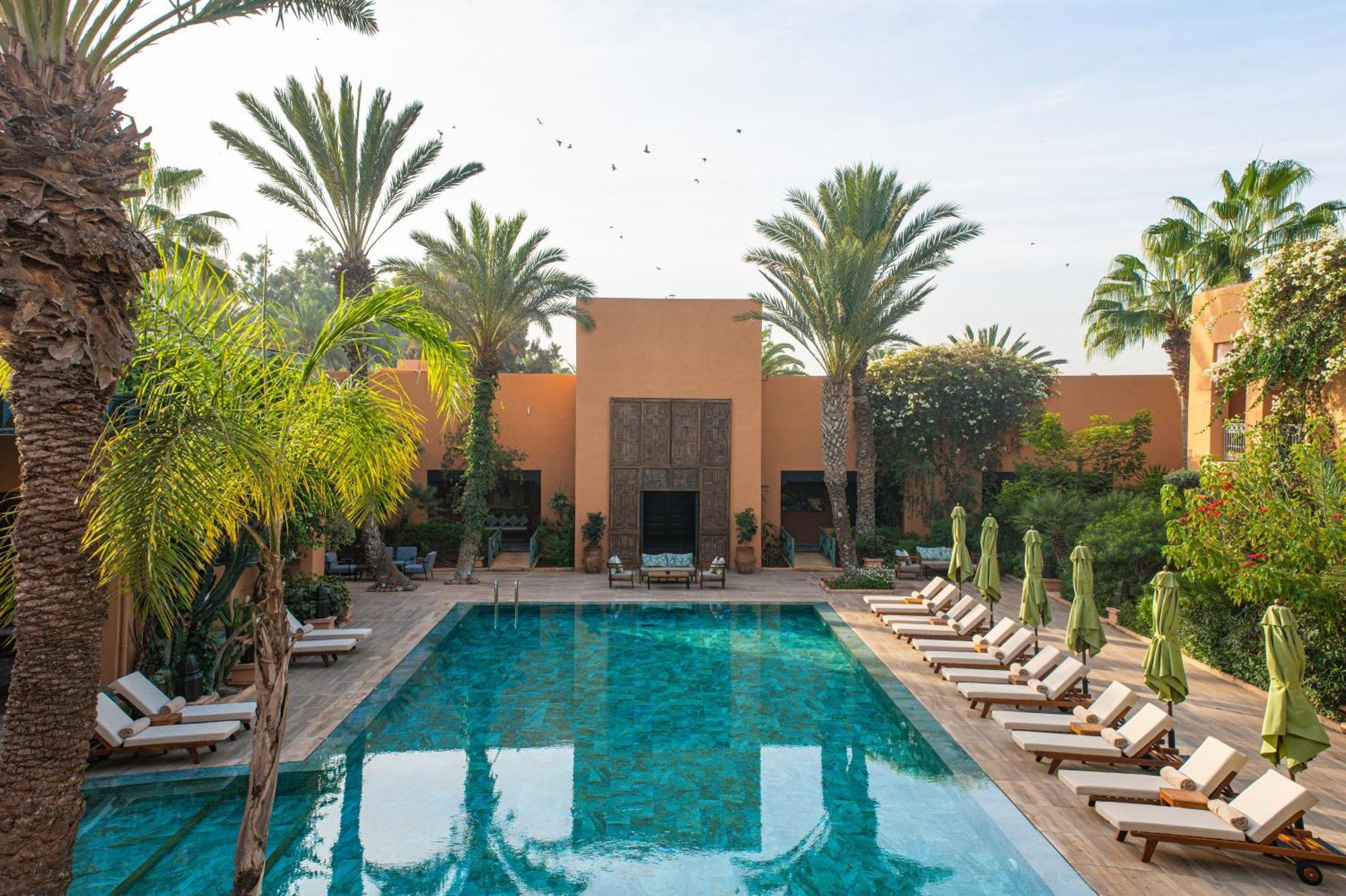 Tikida Golf Palace Agadir Dış mekan fotoğraf The swimming pool at the Ouarzazate hotel
